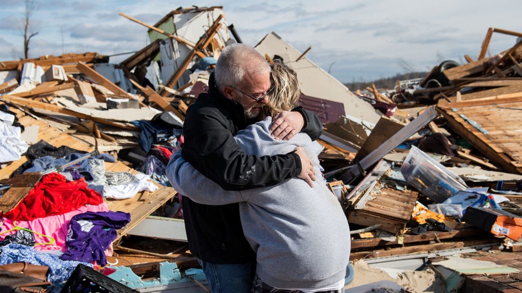 Image: Mike Castle hugs his daughter after the tornado in Dawson Springs